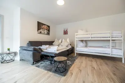 Ein Bett oder Betten in einem Zimmer der Unterkunft EifelComfort Traumhafte Ferienwohnung für 6 Personen in zentraler Lage!