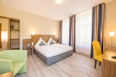 Ein Bett oder Betten in einem Zimmer der Unterkunft Landhotel am Wasserrad