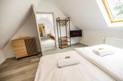 Ein Bett oder Betten in einem Zimmer der Unterkunft EifelComfort Wohnen über den Dächern von Prüm mit der ganzen Familie