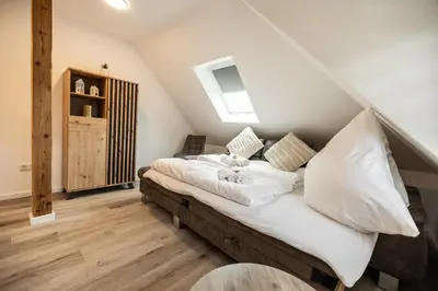Ein Bett oder Betten in einem Zimmer der Unterkunft EifelComfort Wohnen über den Dächern von Prüm mit der ganzen Familie