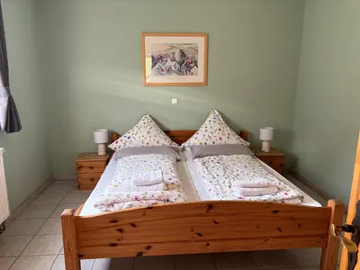 Ein Bett oder Betten in einem Zimmer der Unterkunft Ferienwohnung Burg Katz