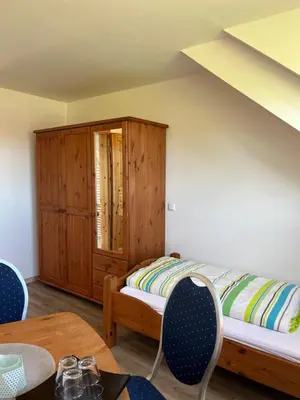Ein Bett oder Betten in einem Zimmer der Unterkunft Ferienwohnung Burg Maus