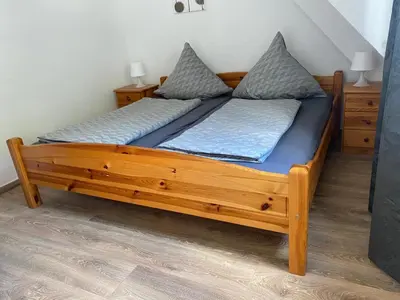 Ein Bett oder Betten in einem Zimmer der Unterkunft Ferienwohnung Retzbachtal