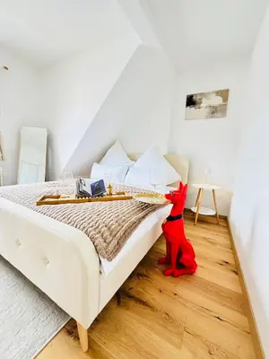 Ein Bett oder Betten in einem Zimmer der Unterkunft Schöne & gemütliche Wohnung direkt am Bahnhof