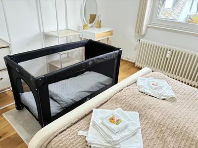Ein Bett oder Betten in einem Zimmer der Unterkunft Schöne & gemütliche Wohnung direkt am Bahnhof