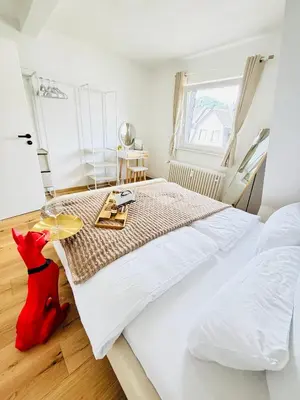 Ein Bett oder Betten in einem Zimmer der Unterkunft Schöne & gemütliche Wohnung direkt am Bahnhof