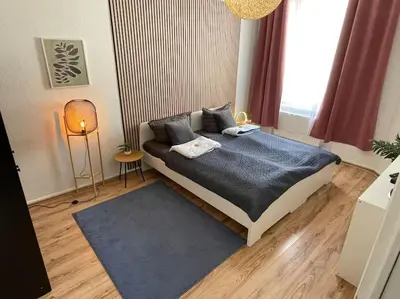 Ein Bett oder Betten in einem Zimmer der Unterkunft Schönes Apartment Mitten in der Stadt 4