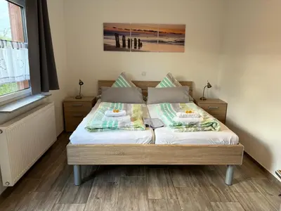Ein Bett oder Betten in einem Zimmer der Unterkunft Haus Taunusblick