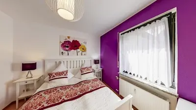 Ein Bett oder Betten in einem Zimmer der Unterkunft Ferienwohnung Seeblick I