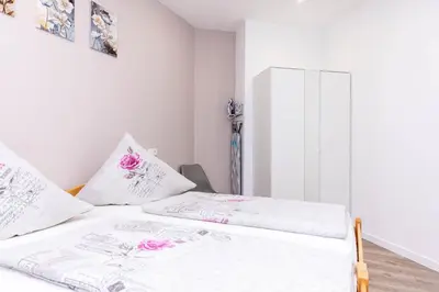 Ein Bett oder Betten in einem Zimmer der Unterkunft NEU I Ferienwohnung Jasmin