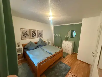 Ein Bett oder Betten in einem Zimmer der Unterkunft Ferienwohnung Thelen