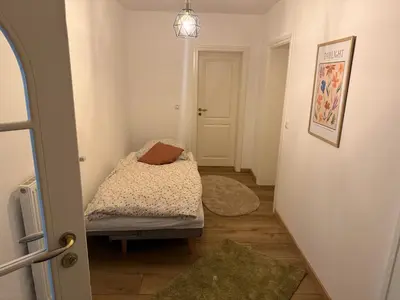 Ein Bett oder Betten in einem Zimmer der Unterkunft Ferienwohnung Thelen