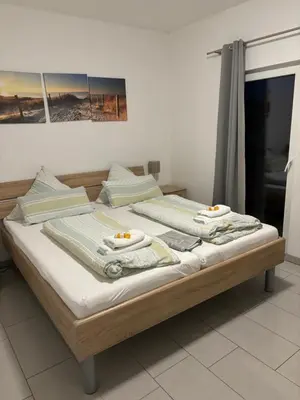 Ein Bett oder Betten in einem Zimmer der Unterkunft Haus Deutsches-Eck