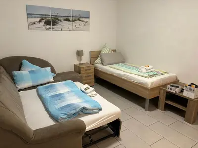 Ein Bett oder Betten in einem Zimmer der Unterkunft Haus Deutsches-Eck