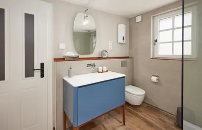 Ein Badezimmer in der Unterkunft Winzerhaus 1658 - Ferienwohnung und Apartments