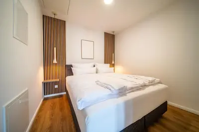 Ein Bett oder Betten in einem Zimmer der Unterkunft Coblenz Suites - Studio Apartments
