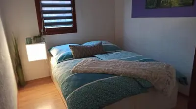 Ein Bett oder Betten in einem Zimmer der Unterkunft Waldhäuschen