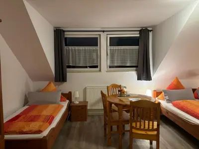 Ein Bett oder Betten in einem Zimmer der Unterkunft Ferienwohnung Moseltal