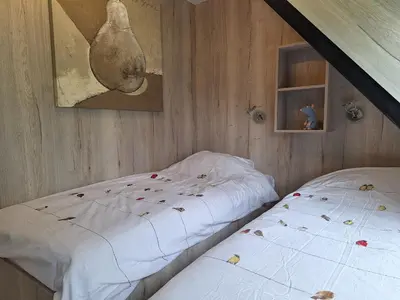 Ein Bett oder Betten in einem Zimmer der Unterkunft Ferienhaus Waldidyll