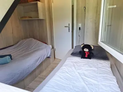 Ein Bett oder Betten in einem Zimmer der Unterkunft Ferienhaus Waldidyll
