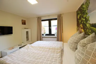 Ein Bett oder Betten in einem Zimmer der Unterkunft Mühlentaler Ferienwohnungen