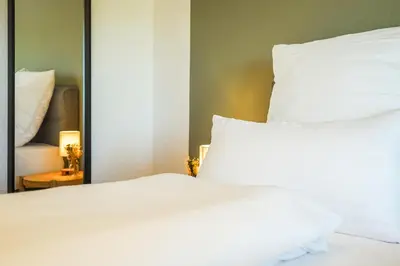 Ein Bett oder Betten in einem Zimmer der Unterkunft 7Seas Boutique Ferienhaus Bostalsee - 2 Apartments oder ganzes Haus, mit Sauna