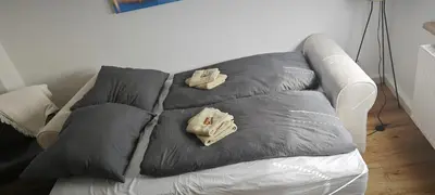 Ein Bett oder Betten in einem Zimmer der Unterkunft Rheinblick Koblenz Kaiser Wilhelm