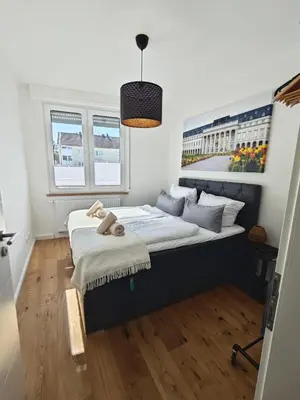 Ein Bett oder Betten in einem Zimmer der Unterkunft Rheinblick Koblenz Kaiser Wilhelm