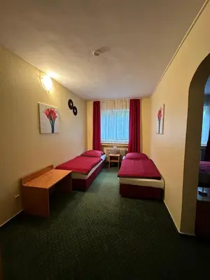 Ein Bett oder Betten in einem Zimmer der Unterkunft Hotel Holl Beyra