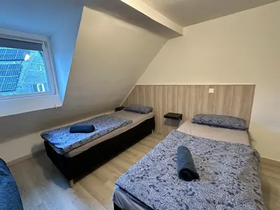 Ein Bett oder Betten in einem Zimmer der Unterkunft Rhaunen Apartments