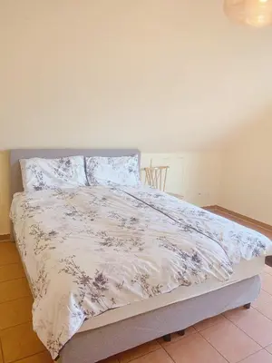 Ein Bett oder Betten in einem Zimmer der Unterkunft OTTOC Ferienwohnung