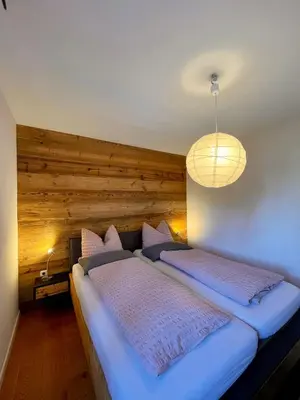 Ein Bett oder Betten in einem Zimmer der Unterkunft Ferienwohnung Magma