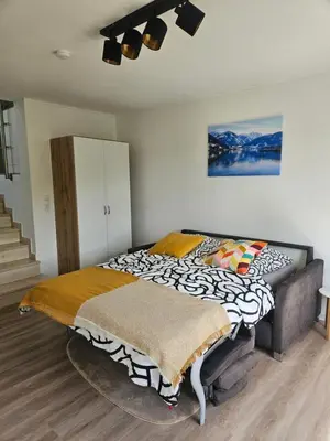 Ein Bett oder Betten in einem Zimmer der Unterkunft Wohnen am Allerheiligenberg