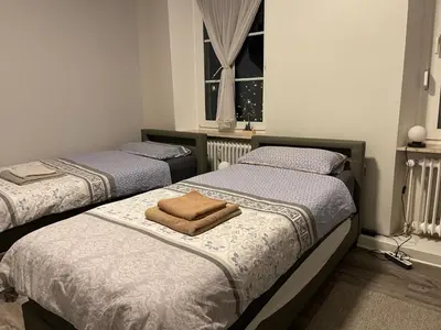 Ein Bett oder Betten in einem Zimmer der Unterkunft Pellinger-Hof