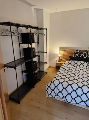 Ein Bett oder Betten in einem Zimmer der Unterkunft Ferienwohnung Edgar und 300 qm Garten Trier Mosel Eifel