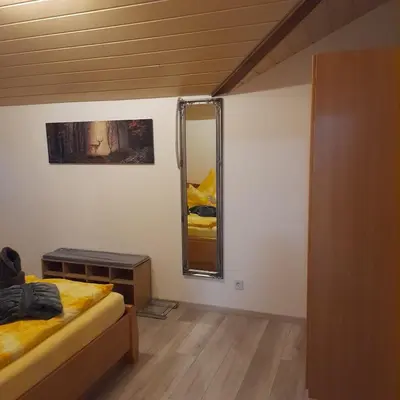 Ein Bett oder Betten in einem Zimmer der Unterkunft Bichlhof Bärfra Ferienwohnung Fernsicht