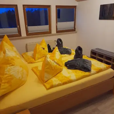 Ein Bett oder Betten in einem Zimmer der Unterkunft Bichlhof Bärfra Ferienwohnung Fernsicht