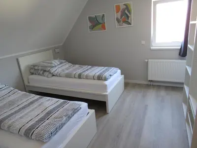 Ein Bett oder Betten in einem Zimmer der Unterkunft Ferienwohnungen Rheinhöhe