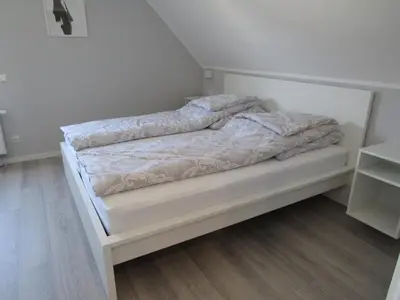 Ein Bett oder Betten in einem Zimmer der Unterkunft Ferienwohnungen Rheinhöhe