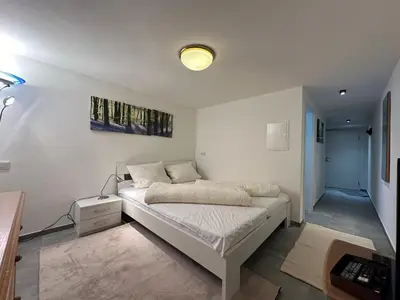 Ein Bett oder Betten in einem Zimmer der Unterkunft Fewo Waldblick - Urlaub im Wein & Ferienort Bekond