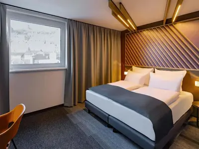 Ein Bett oder Betten in einem Zimmer der Unterkunft B&B HOTEL Idar-Oberstein