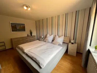 Ein Bett oder Betten in einem Zimmer der Unterkunft Ferienwohnung Zum Kallenborn