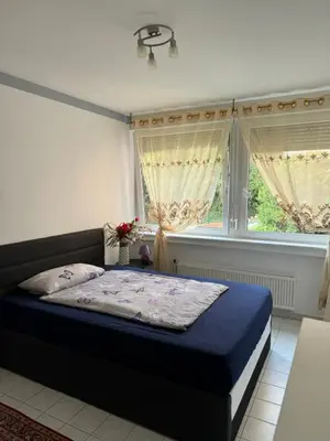 Ein Bett oder Betten in einem Zimmer der Unterkunft Ferienwohnung Bingen