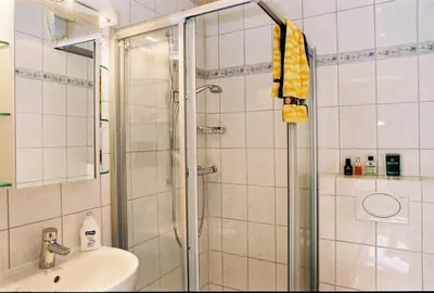 Ein Badezimmer in der Unterkunft Pension Hilberath