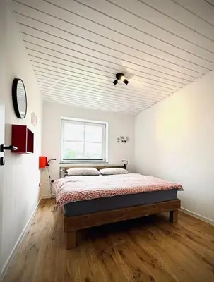 Ein Bett oder Betten in einem Zimmer der Unterkunft Ruhiges Lay-Haus in der Vulkaneifel, bis zu 7 Personen mit Terrasse, Garten und Kamin