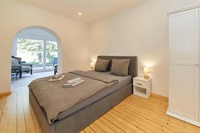 Ein Bett oder Betten in einem Zimmer der Unterkunft Haus am Moselufer - EG Apartment