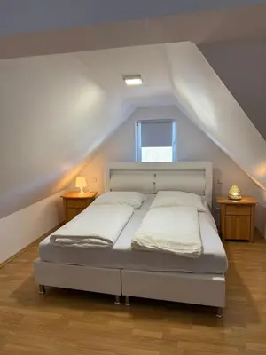 Ein Bett oder Betten in einem Zimmer der Unterkunft AdiFerienwohnung