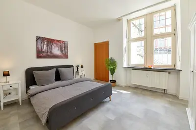Ein Bett oder Betten in einem Zimmer der Unterkunft Ferienwohnungen am Gestade Wohnung 2