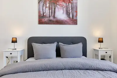 Ein Bett oder Betten in einem Zimmer der Unterkunft Ferienwohnungen am Gestade Wohnung 2