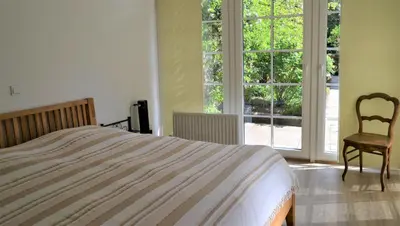 Ein Bett oder Betten in einem Zimmer der Unterkunft Ferienwohnungen am Stadtpalais Haus Weinberg